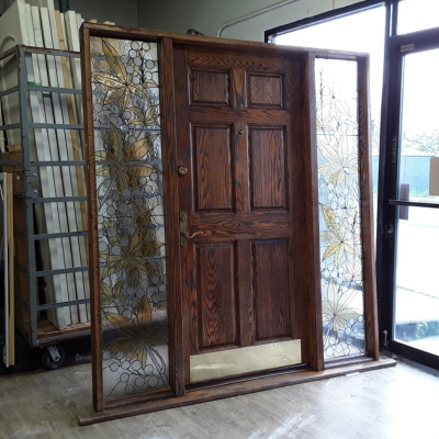 Wooden door with stainless windows